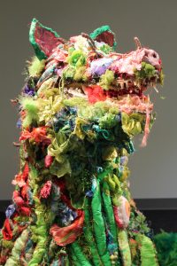 Mixed media sculpture of a wolf-like creature by Kelly Boehmer.