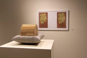 A sculpture of concrete and found pinewood by M. Paige Ward