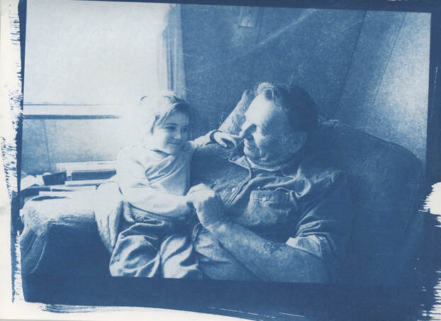 Cyanotype "Guardian Angel" of young Wynn sitting in her grandfather's lap.