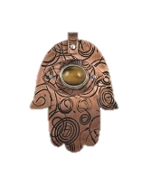 Copper pendant in the shape of a hamsa with a tiger's eye bezel setting and stamped designs. 