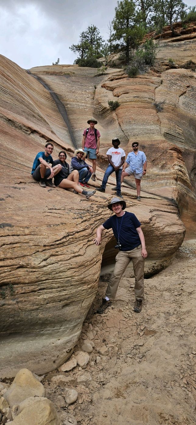 Students stand in a slot canyon