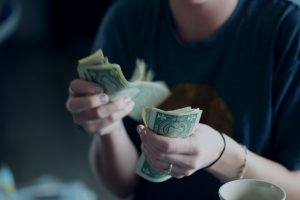 Read more about the article The Importance of Financial Wellness: Tips on Saving Money in College