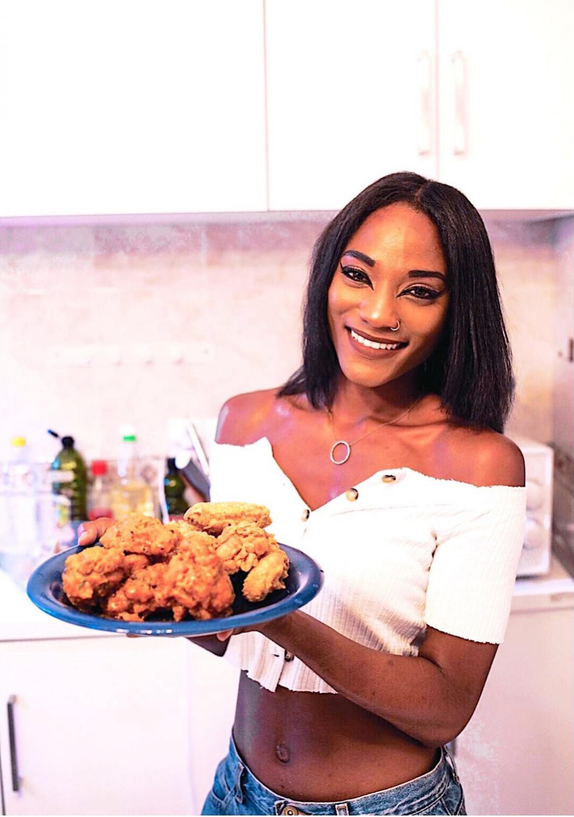 Tara Brown holding plate of chicken